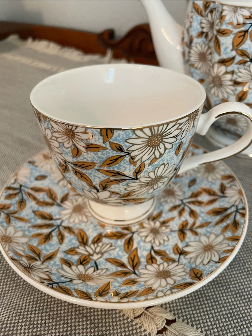 Elegant Floral Porcelain Teapot and Cup Set in Blue and Gold